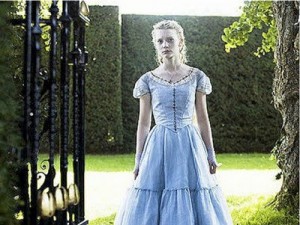 A scene from Alice in Wonderland - Alice standing in a garden