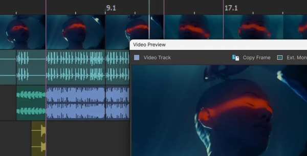 Acid Pro timeline with a video track and preview window showing a singer in red light above synced audio waveforms.