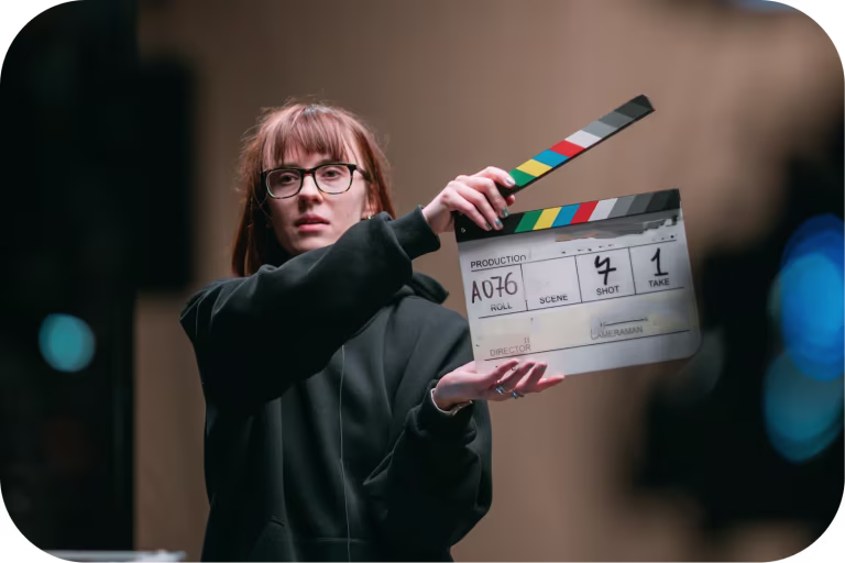 Woman Holding/Directing Movie Scence