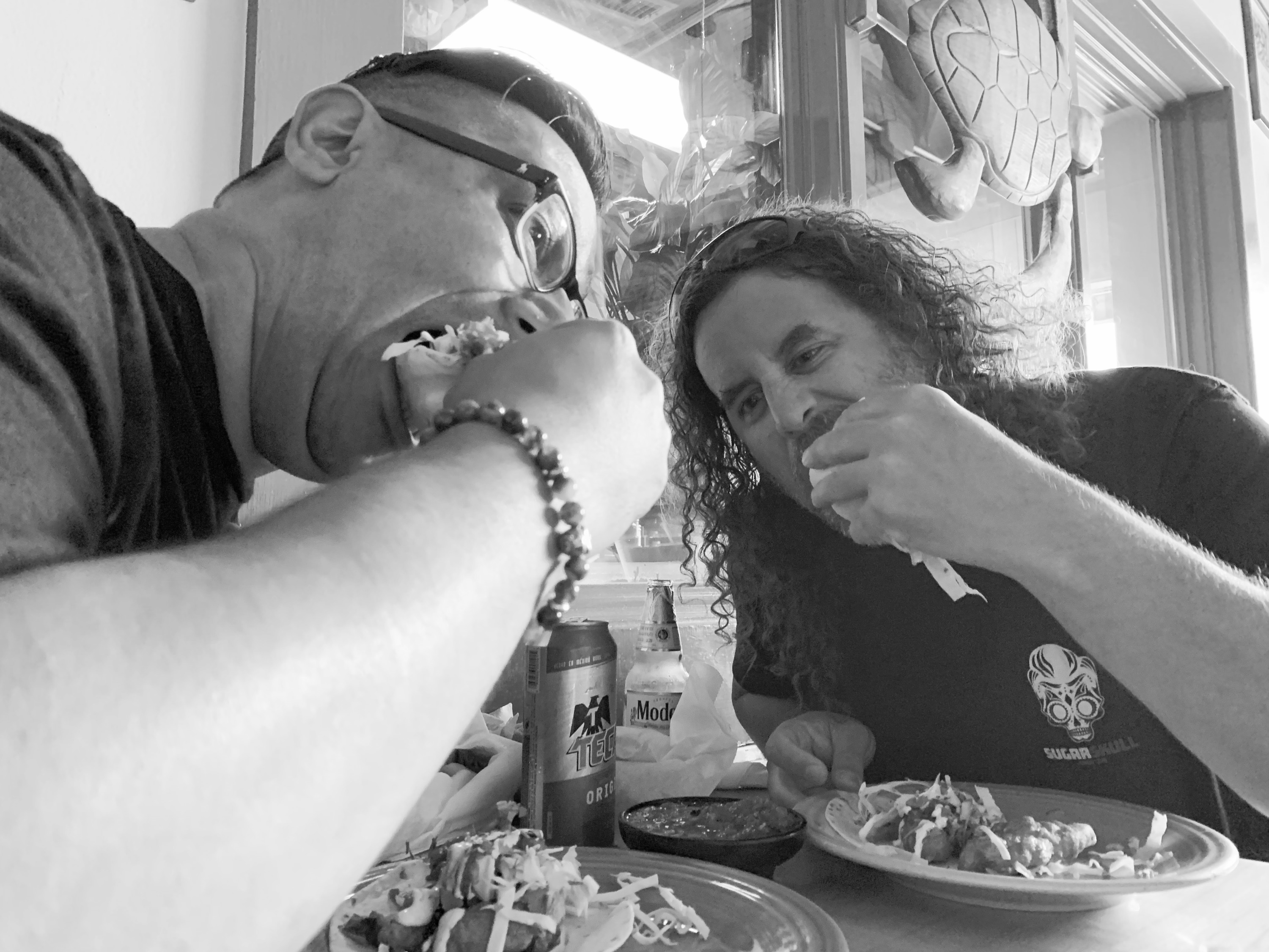 Alejandro Brubaker and Steve Strickland eating tacos