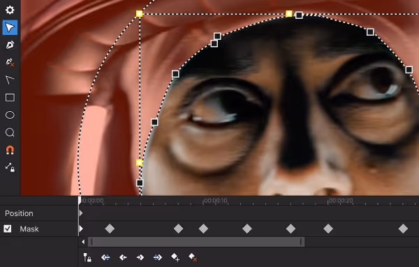 Close-up of a face with a dotted Bezier mask drawn around the eyes, mask tool toolbar on the left and Mask keyframes on the timeline below.