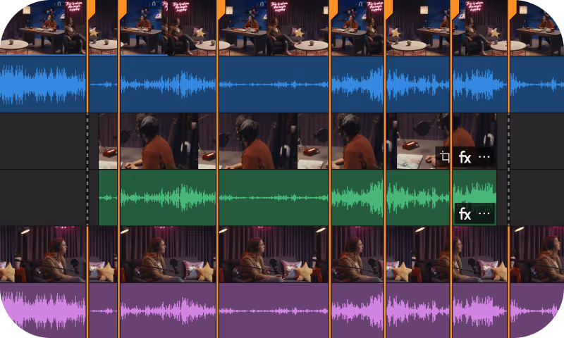 Video editing timeline showing multiple tracks with video clips and audio waveforms in blue, green, and purple colors, separated by orange vertical lines.