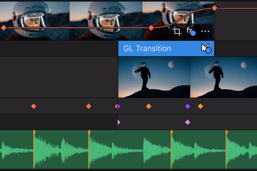 Video editing timeline showing clips of a person in a helmet and a silhouette of a person walking on a hill with waveform audio tracks below.