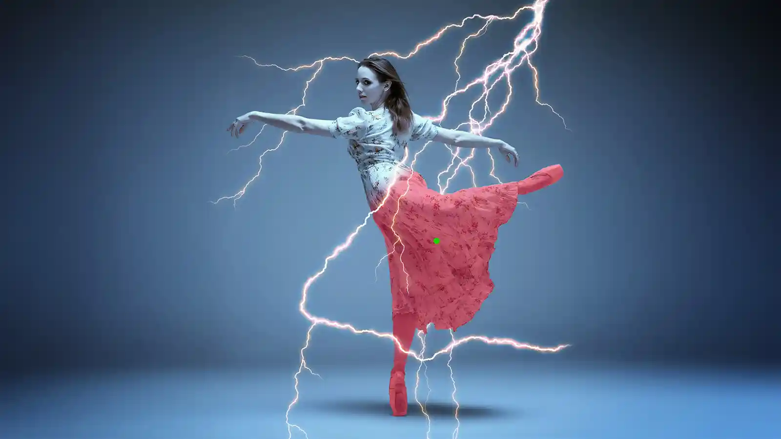 Ballet dancer mid-pose surrounded by lightning-bolt effects, her skirt isolated with a red mask overlay.