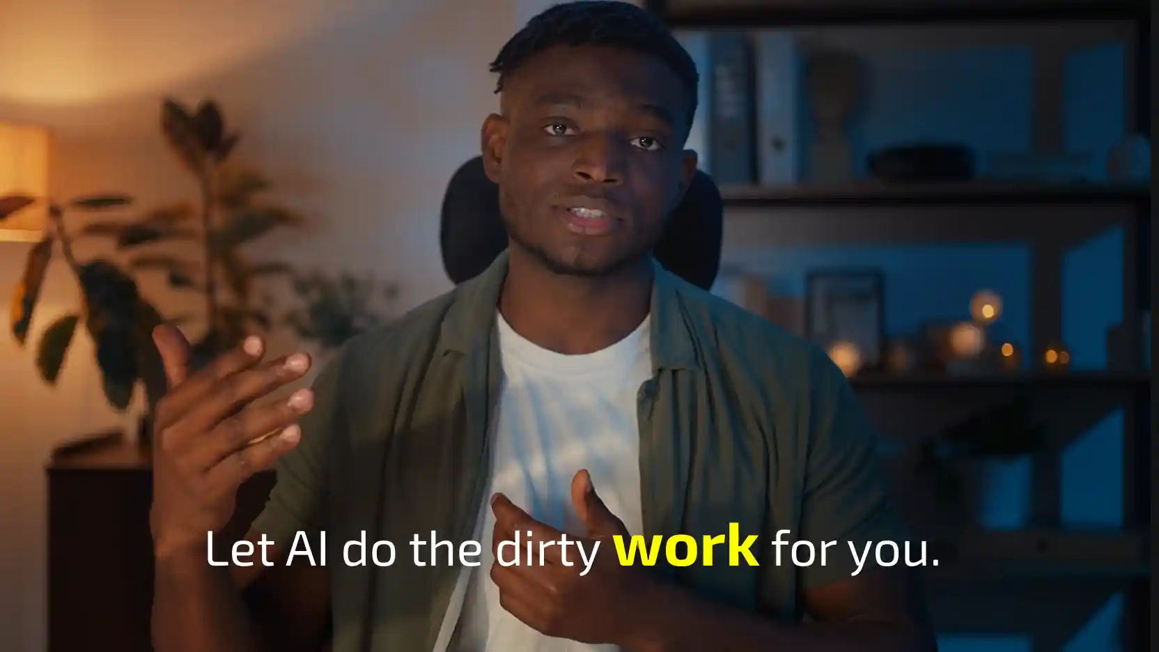 Man speaking to camera in a dim room with shelves and warm lights, with the caption 'Let AI do the dirty work for you.' and 'work' highlighted in yellow.